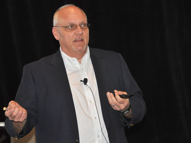 Iowa State University plant pathologist Greg Tylka highlighted the challenges facing researchers in the fight to defeat soybean cyst nematode, at an SCN Conference in Miami. (DTN photo by Emily Unglesbee) 
